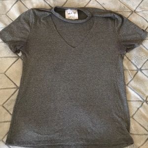 Super cute grey top with v-neck and neck line